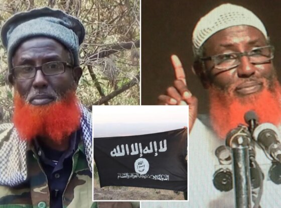 An image collage containing 3 images, Image 1 shows Abdul Qadir Mumin, an Islamist militant leader, in a camouflage jacket with a red beard, Image 2 shows Portrait of Somali-born cleric Abdulqadir Mumin, accused of heading the Islamic State group in East Africa, Image 3 shows Two militants in military gear hold up a black flag with white Arabic script