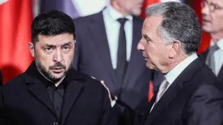 Ukrainian President Volodymyr Zelensky talks with Trump's special envoy Steve Witkoff before the summit with European leaders in Berlin.