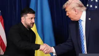 Donald Trump and Volodymyr Zelensky shake hands during a press conference at Mar-a-Lago in Palm Beach, Florida.