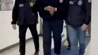 Image showing Venezuelan President Nicolás Maduro being taken into custody down a hallway at the offices of the US Drug Enforcement Administration (DEA) in New York