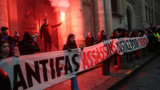 A group of people demand justice for the activist who died after an attack by a far-left group.