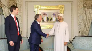 Middle East special envoy Steve Witkoff, with Jared Kushner, shakes hands with Omani Foreign Minister Sayyid Badr bin Hamad Al Busaidi on Friday, ahead of high-level talks with Iran in Oman.
