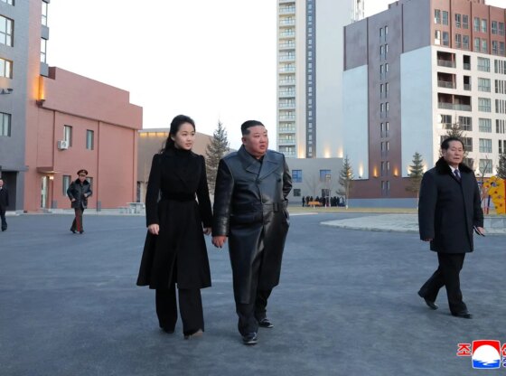 Kim Jong-un and his daughter, Kim Ju-ae, walk through the new neighborhood.