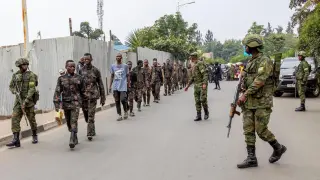 Rwandan security officers receive FARDC soldiers who surrendered in Goma