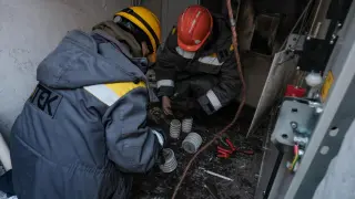 DTEK workers repair an electrical substation in the center of kyiv, in the midst of extreme cold and Russian bombing.