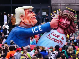 A carnival float depicting Donald Trump beating Jesus Christ, during the traditional Rosenmontag (Rose Monday) carnival parade in Düsseldorf.
