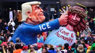 A carnival float depicting Donald Trump beating Jesus Christ, during the traditional Rosenmontag (Rose Monday) carnival parade in Düsseldorf.