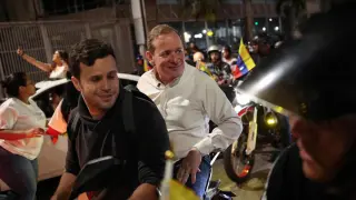 Juan Pablo Guanipa, in a white shirt, leads a motorcycle march through the streets of Caracas before being arrested.