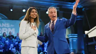 Former British Home Secretary Suella Braverman poses with Nigel Farage during the “Veterans for Reform” press presentation in London.