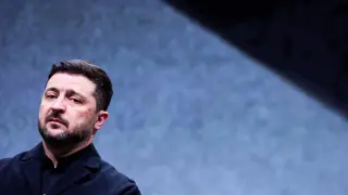 Ukrainian President Volodymyr Zelensky looks on during a visit to a plant of German drone maker Quantum Systems.